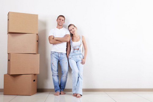 Professional packers handling boxes in a Wandsworthon home