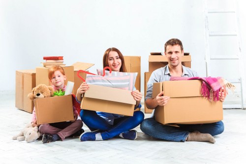 Professional movers handling office furniture